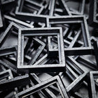 Close-up of injection moulded base converters 20mm to 25mm square size