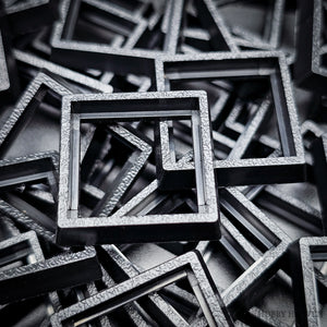 Close-up of injection moulded base converters 20mm to 25mm square size