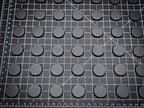 Set of 25mm round ABS plastic bases arranged in a grid, perfect for Warhammer 40k miniatures.