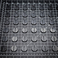 Set of 25mm round Slotted ABS plastic bases arranged in a grid, perfect for Warhammer 40k miniatures.
