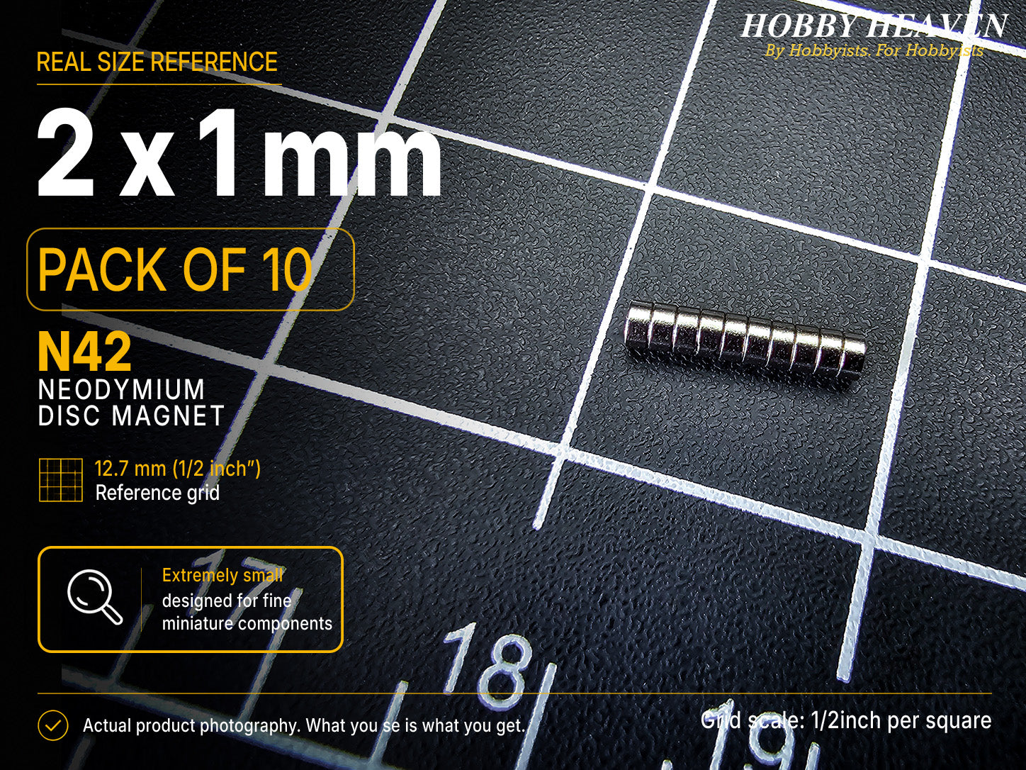 Pack of 10 - 2 x 1 mm N42 neodymium disc magnets stacked in a row on a half-inch reference grid
