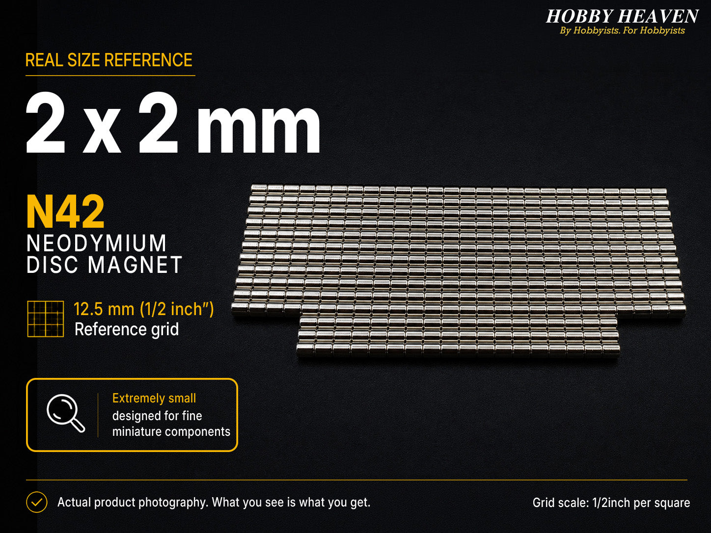 Stacked rows of 2 x 2 mm N42 neodymium disc magnets shown at real size on a half-inch reference grid