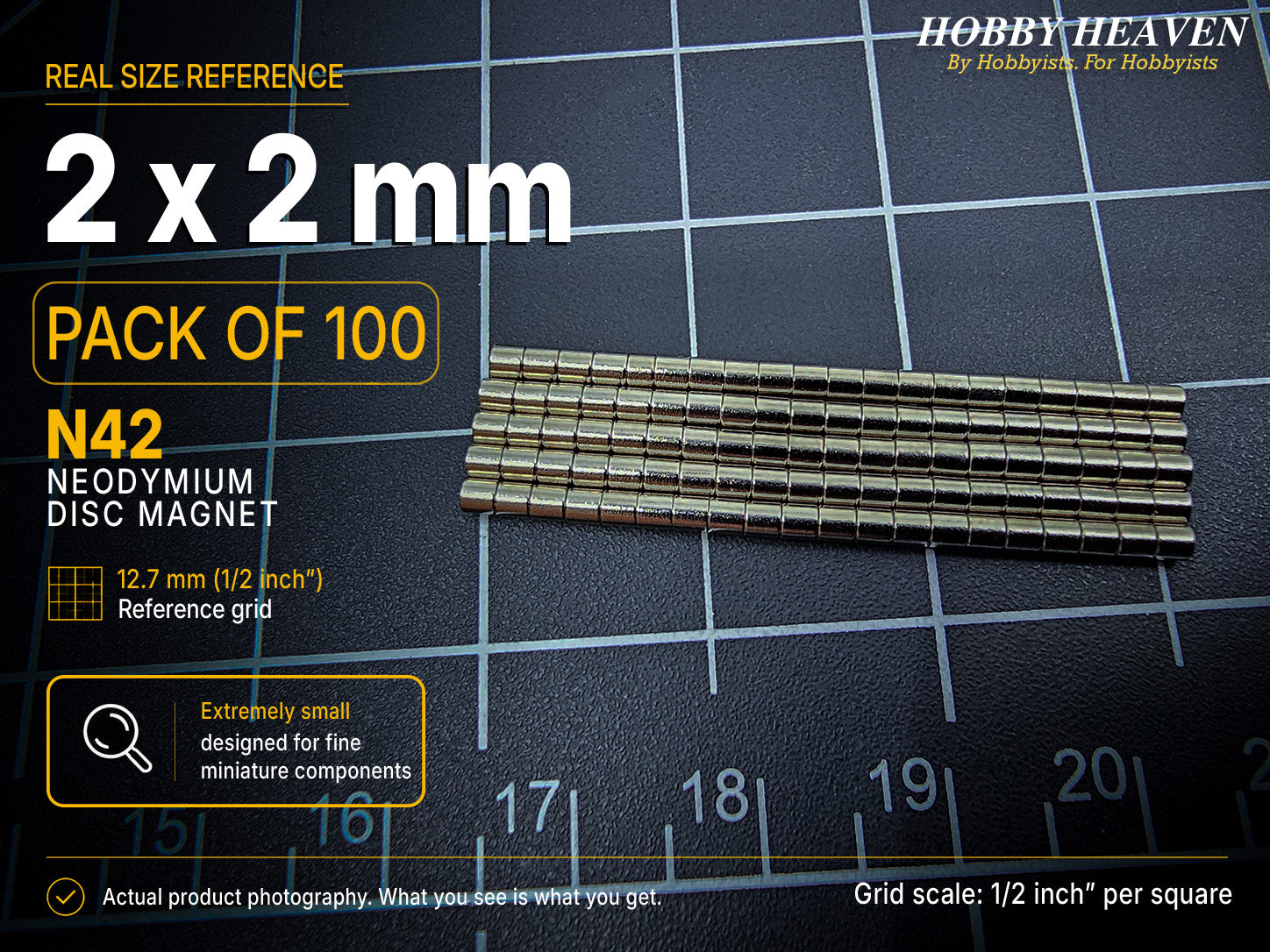 Pack of 100 - one hundred 2 x 2 mm N42 neodymium disc magnets in long stacked rows on a half-inch reference grid