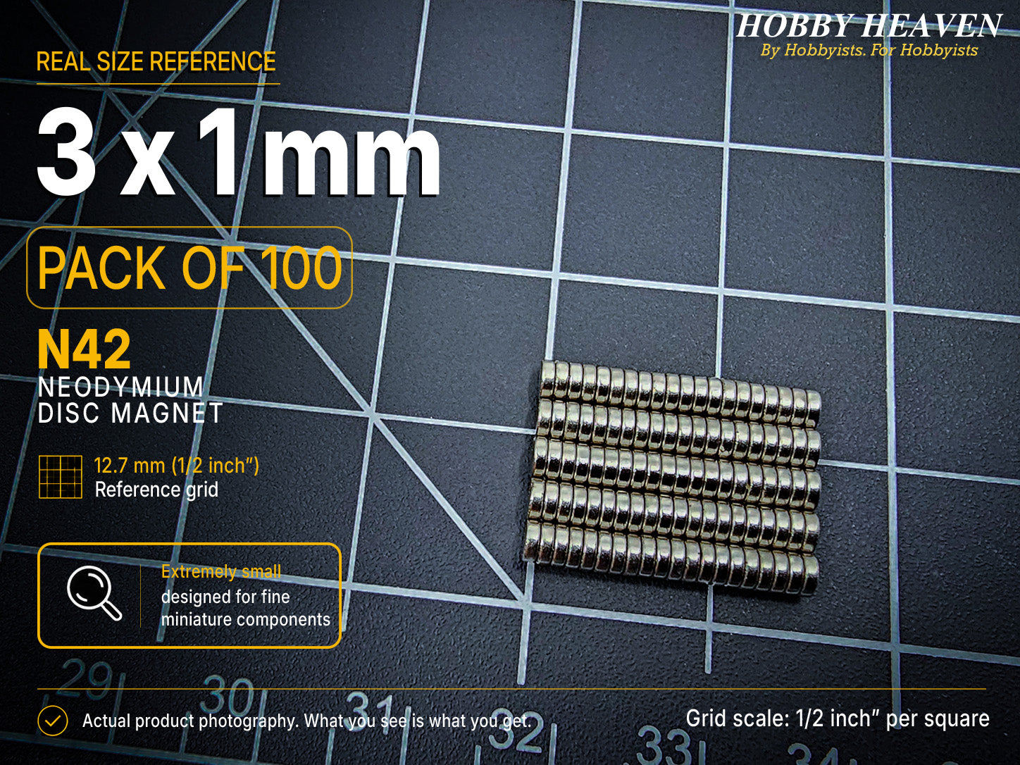 Pack of 100 - one hundred 3 x 1 mm N42 neodymium disc magnets in stacked rows on a half-inch reference grid