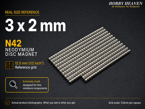 Stacked rows of 3 x 2 mm N42 neodymium disc magnets shown at real size on a half-inch reference grid