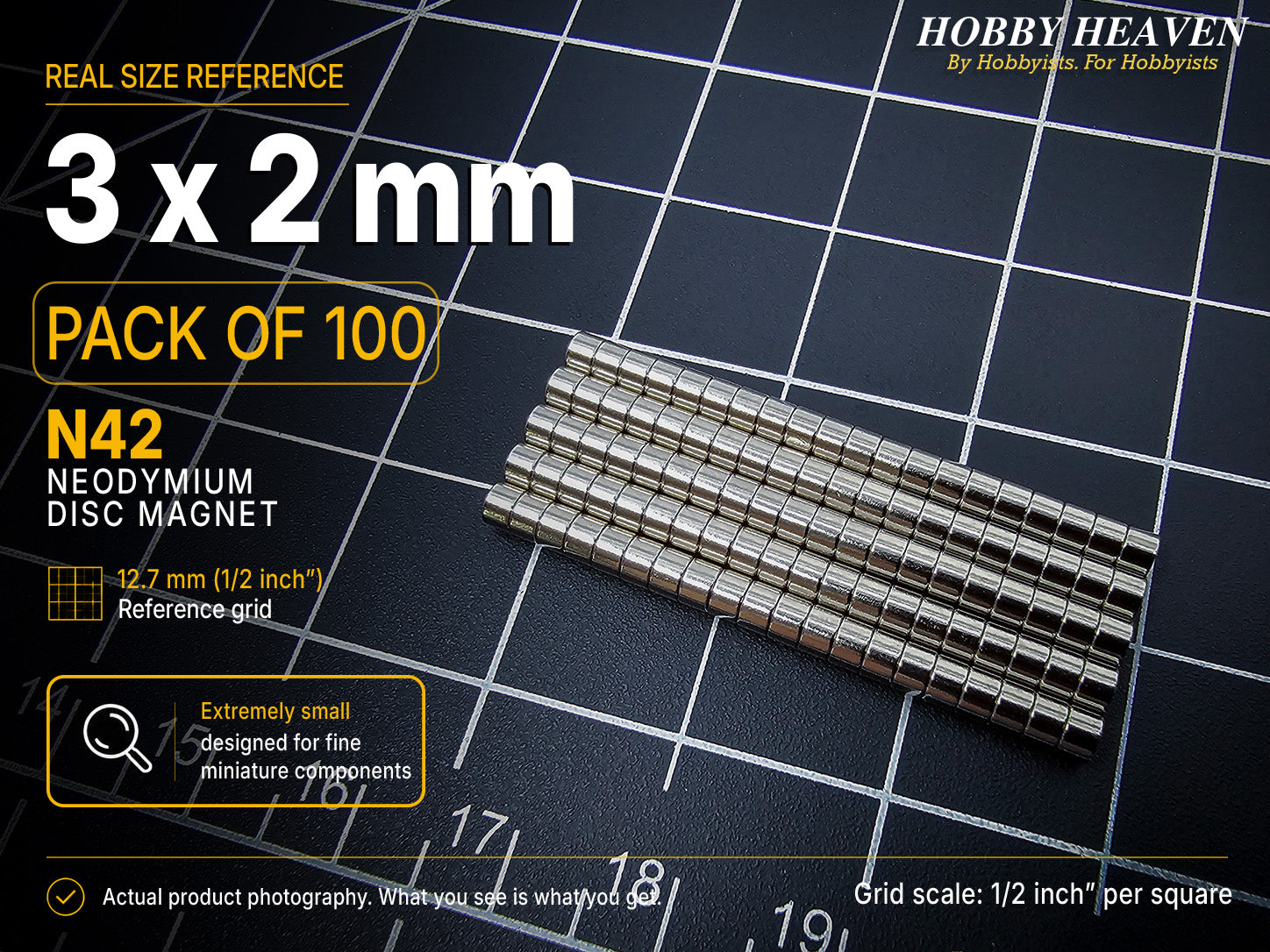 Pack of 100 - one hundred 3 x 2 mm N42 neodymium disc magnets in long stacked rows on a half-inch reference grid