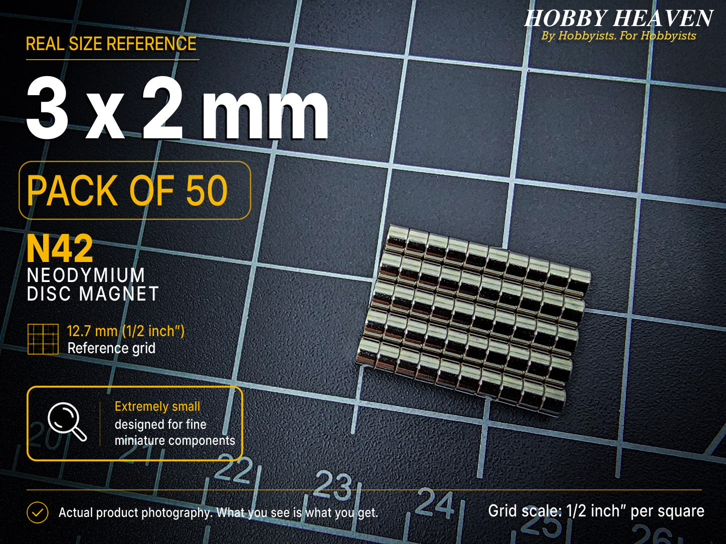Pack of 50 - 3 x 2 mm N42 neodymium disc magnets in stacked rows on a half-inch reference grid