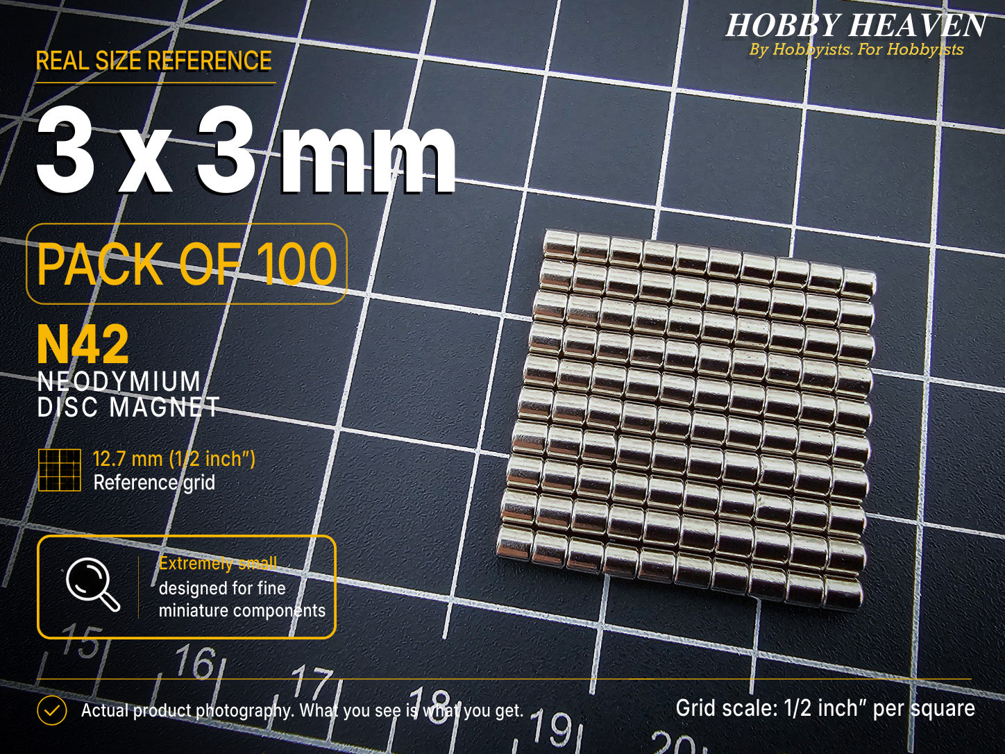 Pack of 100 - one hundred 3 x 3 mm N42 neodymium disc magnets in long stacked rows on a half-inch reference grid