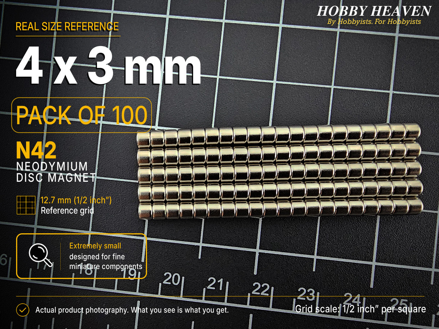 Pack of 100 - one hundred 4 x 3 mm N42 neodymium disc magnets in long stacked rows on a half-inch reference grid