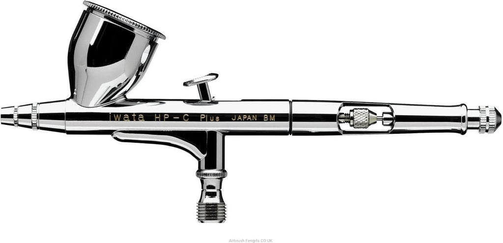 Iwata HP-C Plus side view on white, full body engraving and knurled needle-chucking nut visible