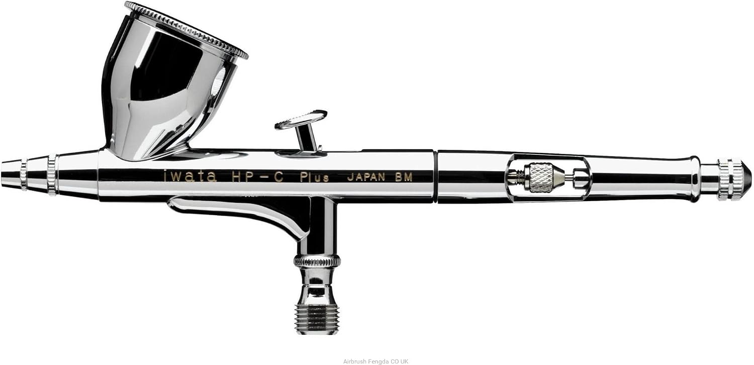 Iwata HP-C Plus side view on white, full body engraving and knurled needle-chucking nut visible