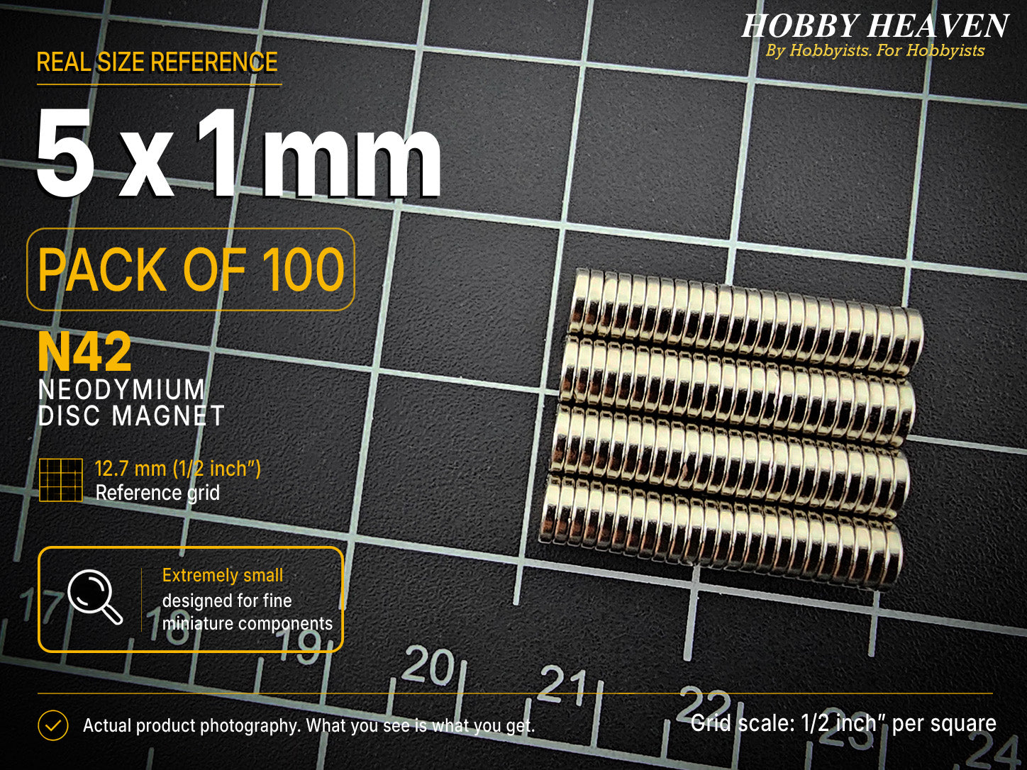 Pack of 100 - one hundred 5 x 1 mm N42 neodymium disc magnets in long stacked rows on a half-inch reference grid