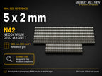 Stacked rows of 5 x 2 mm N42 neodymium disc magnets shown at real size on a half-inch reference grid