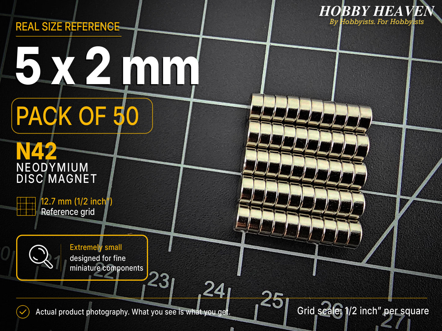 Pack of 50 - 5 x 2 mm N42 neodymium disc magnets in stacked rows on a half-inch reference grid