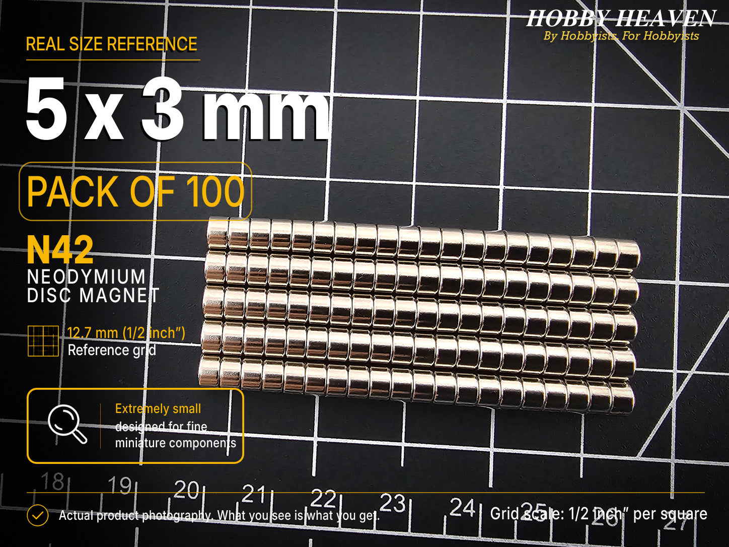 Pack of 100 - one hundred 5 x 3 mm N42 neodymium disc magnets in long stacked rows on a half-inch reference grid