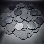 Detailed view of 60mm round bases on black background, emphasizing texture and design