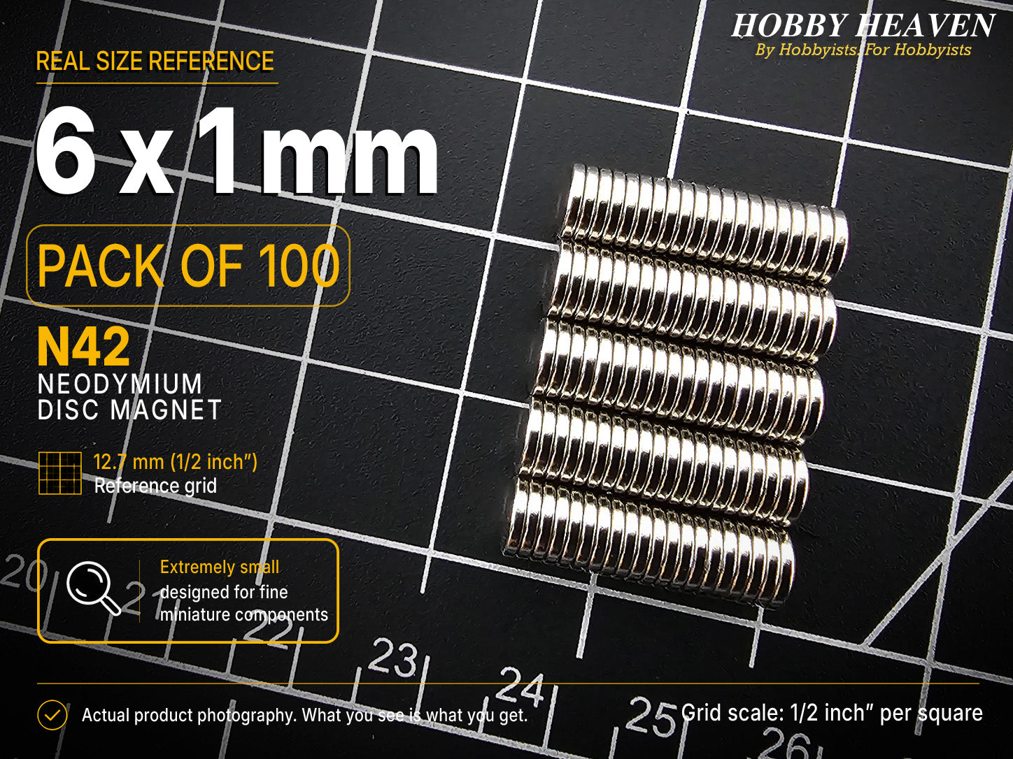 Pack of 100 - one hundred 6 x 1 mm N42 neodymium disc magnets in long stacked rows on a half-inch reference grid