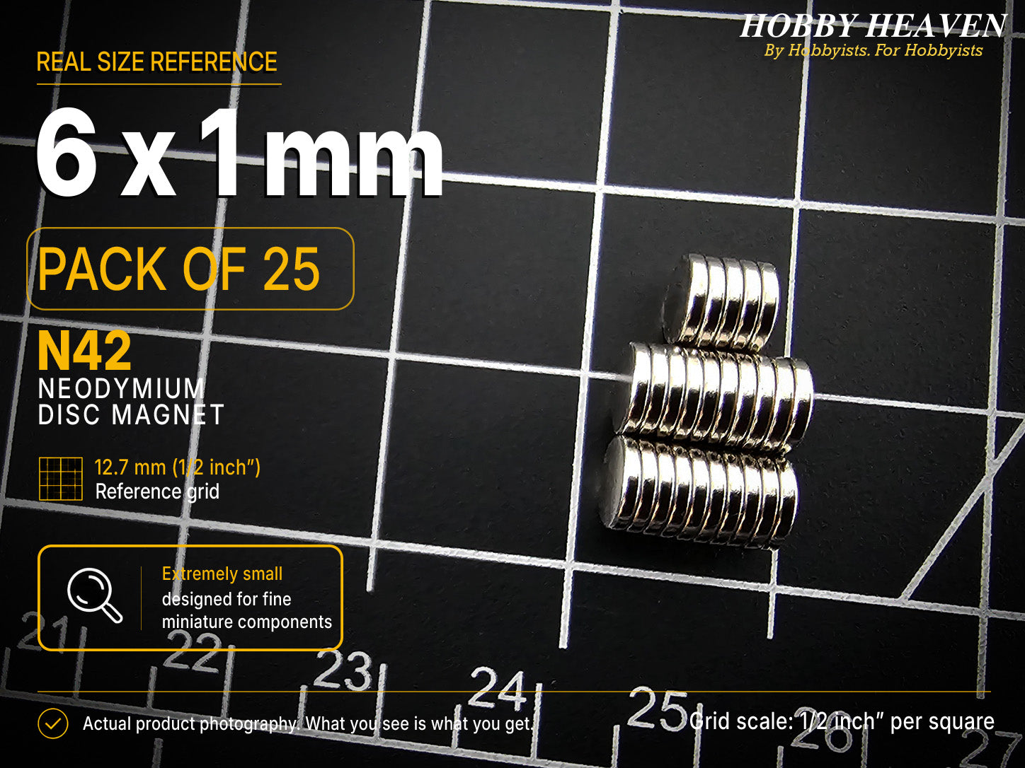 Pack of 25 - 6 x 1 mm N42 neodymium disc magnets in two short stacks on a half-inch reference grid