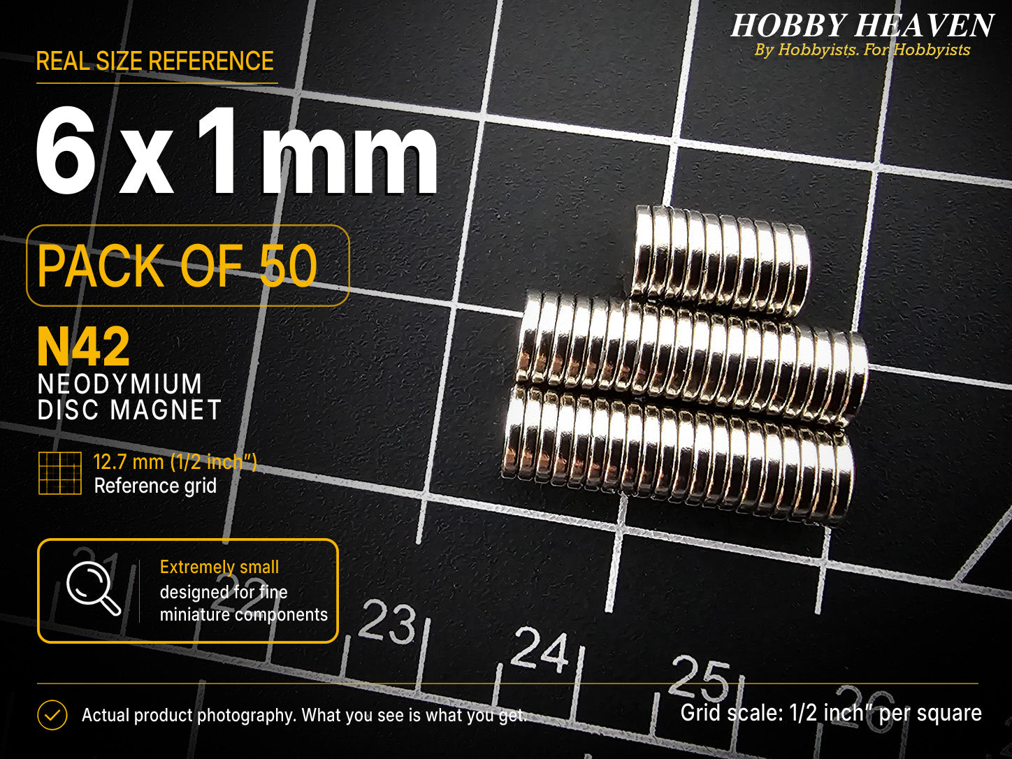 Pack of 50 - 6 x 1 mm N42 neodymium disc magnets in stacked rows on a half-inch reference grid