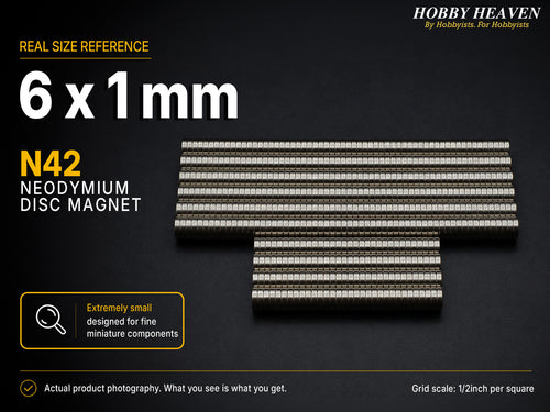 Stacked rows of 6 x 1 mm N42 neodymium disc magnets shown at real size on a half-inch reference grid