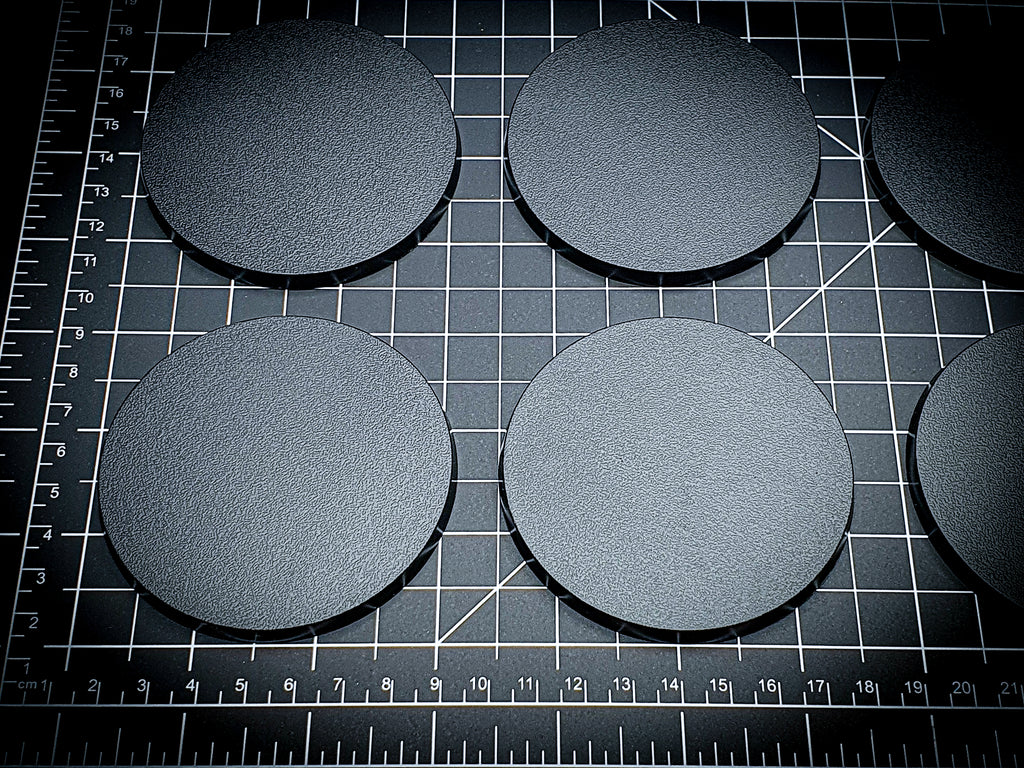 Detailed view of 80mm round bases with texture visible