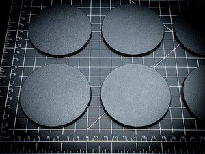 Detailed view of 80mm round bases with texture visible