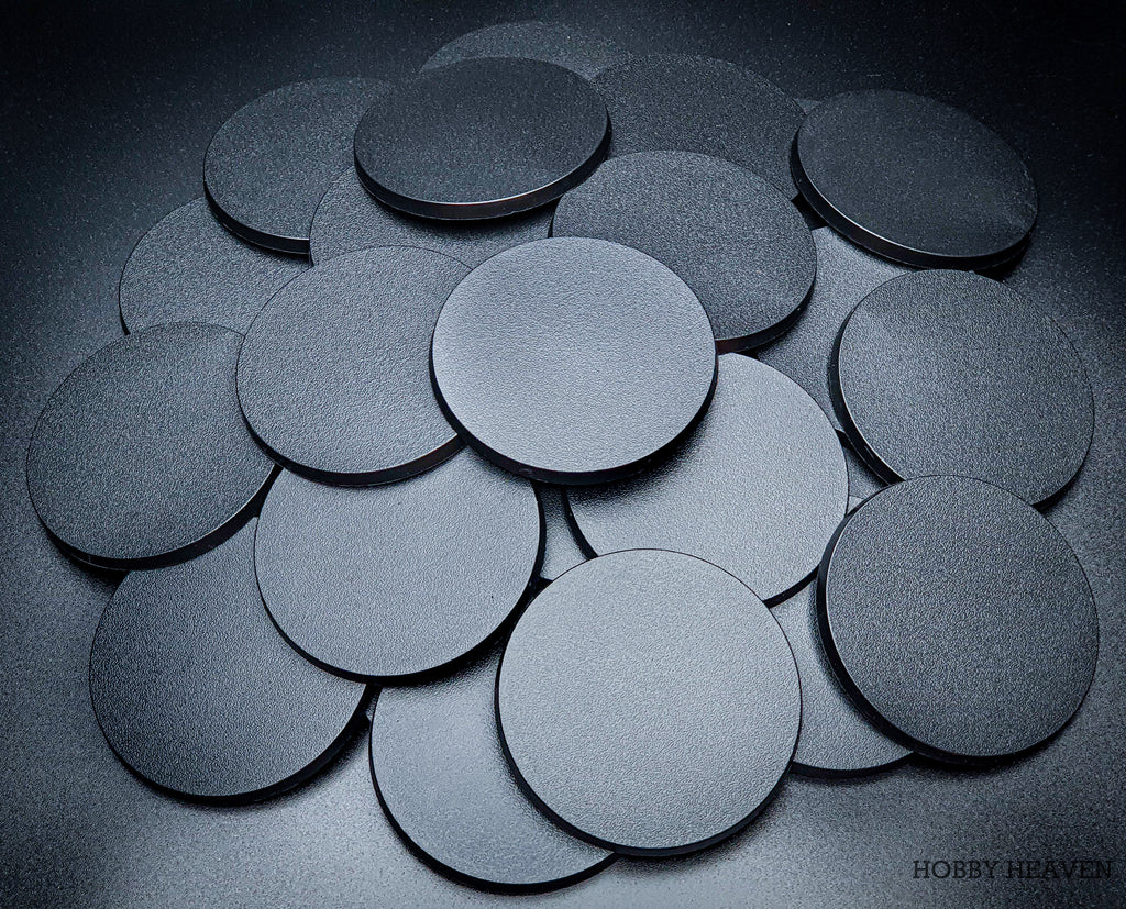 Various angles of 80mm round bases on a black background