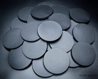 Various angles of 80mm round bases on a black background
