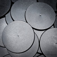 90mm round bases in a group on a black surface, with close-up details.
