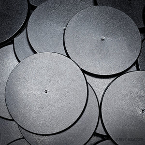 90mm round bases in a group on a black surface, with close-up details.