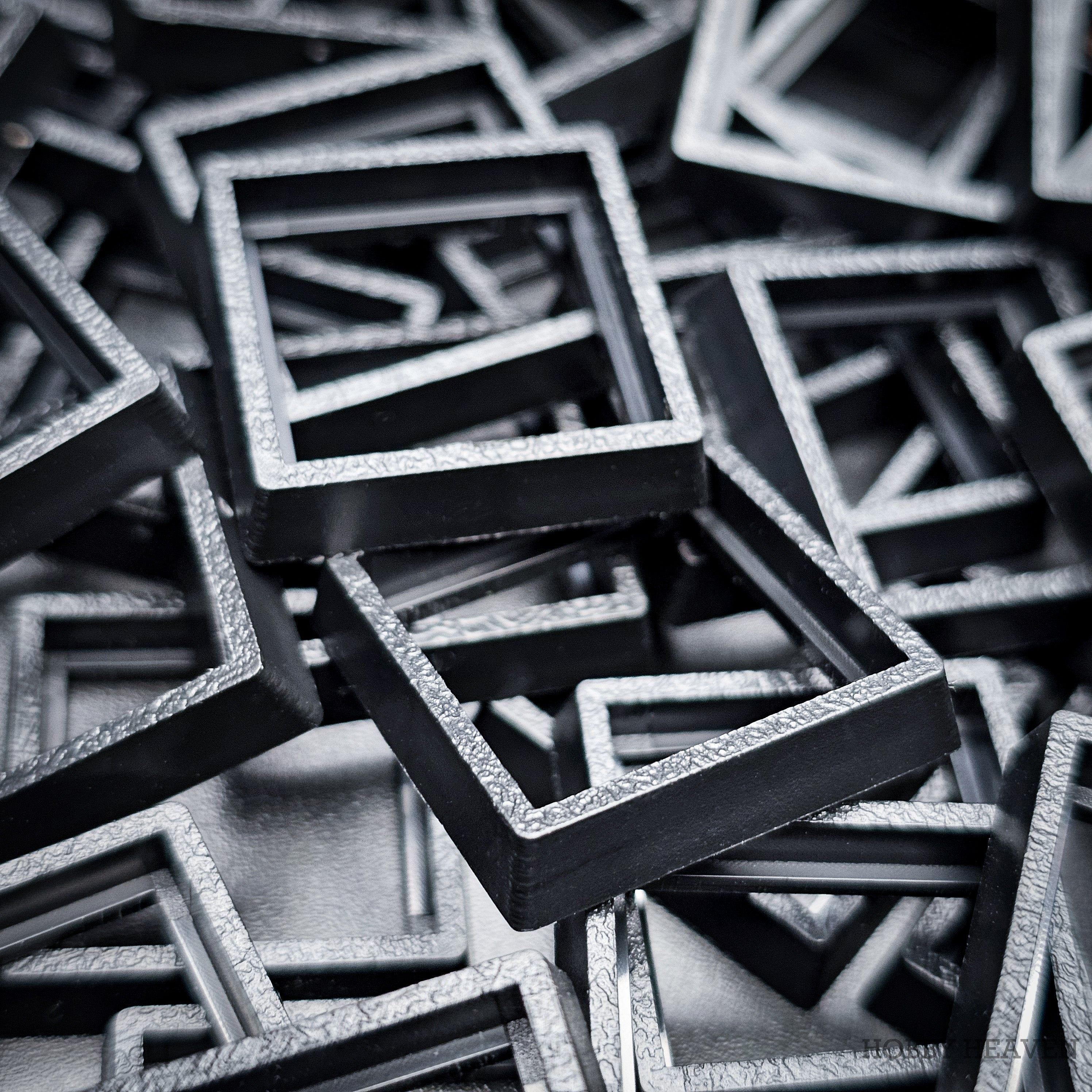 Close-up of injection moulded base converters 20mm to 25mm square size