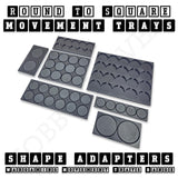 Photograph of seven black round-to-square movement tray adapters in different sizes and formations.