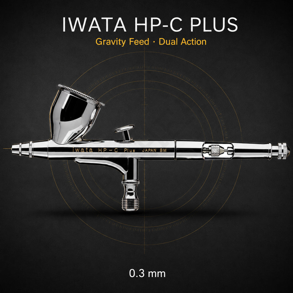 Iwata HP-C Plus airbrush side-on against black, 7 ml gravity cup uppermost, engraved iwata HP-C Plus JAPAN