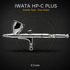 Iwata HP-C Plus airbrush side-on against black, 7 ml gravity cup uppermost, engraved iwata HP-C Plus JAPAN