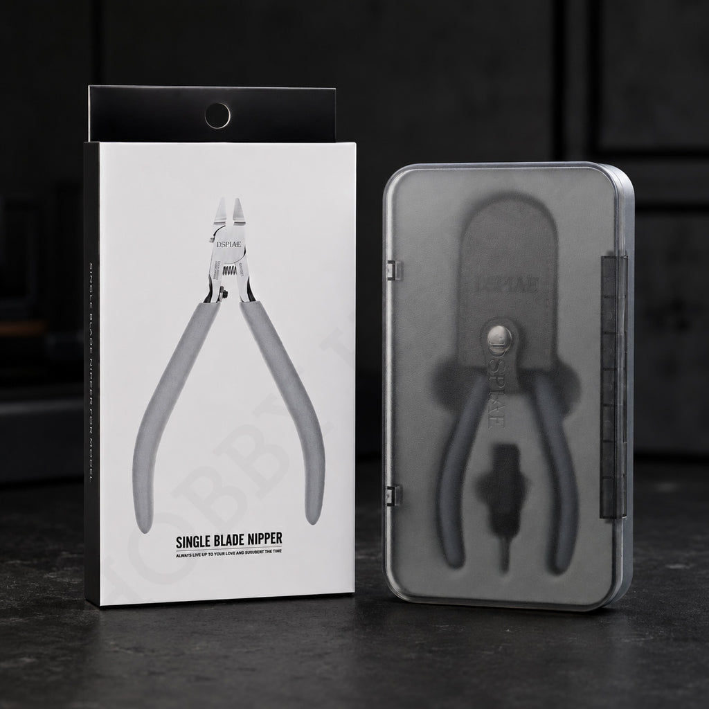 DSPIAE ST-C2 packaging: the white printed box beside the grey magnetic storage case on a dark surface