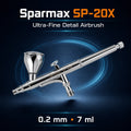 Sparmax SP-20X airbrush on dark blue, engraved SPARMAX SP-20X, with a lidded 7 ml gravity cup and pre-set handle