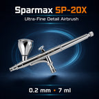 Sparmax SP-20X airbrush on dark blue, engraved SPARMAX SP-20X, with a lidded 7 ml gravity cup and pre-set handle