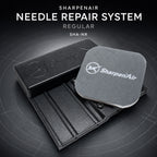 SharpenAir needle repair tool in matte black with its embossed logo, shown with the grey 3000 grit polishing pad