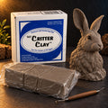 Aves Critter Clay 5 lb box with Native clay blocks in film wrap, a sculpting tool and a sculpted hare
