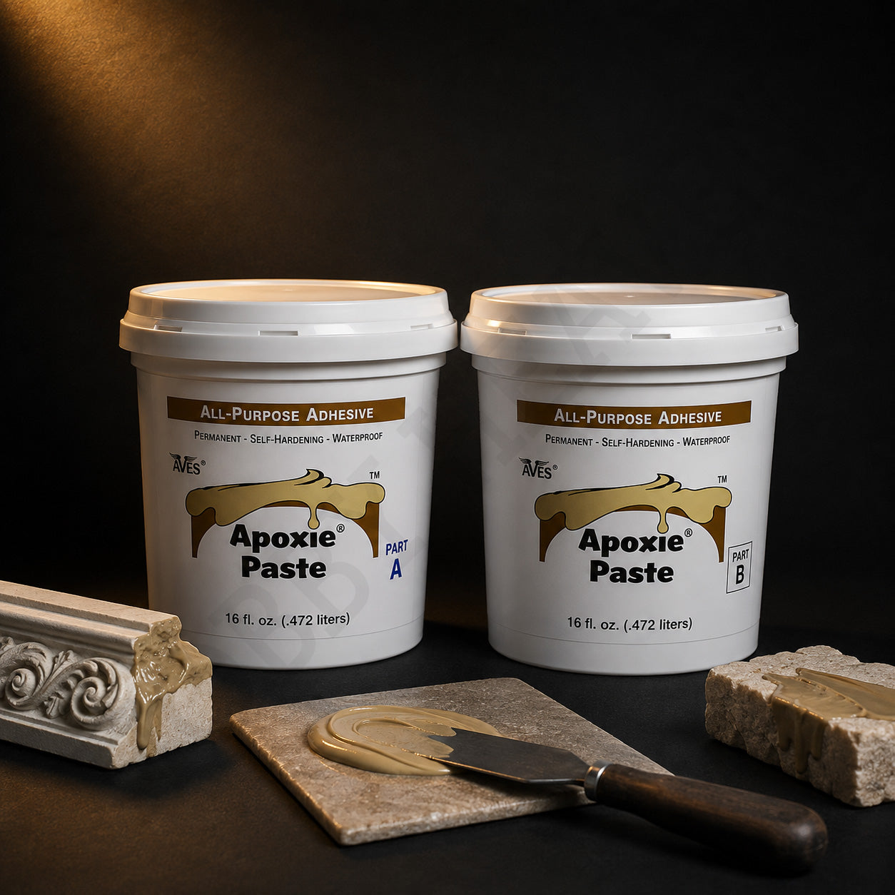 Aves Apoxie Paste Part A and Part B tubs with khaki paste on a knife, a moulded stone corner and a stone block