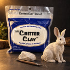 Aves Critter Clay 1 lb bag in White with a lump of white clay, a sculpting tool and a sculpted hare