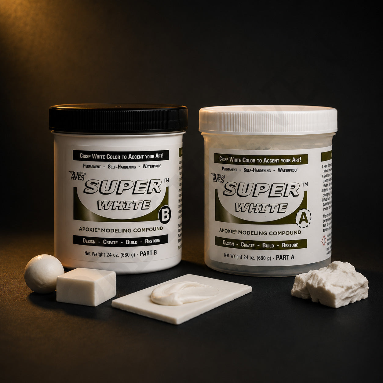 Aves Super White Apoxie Part A and Part B jars beside cured white samples: a ball, a block, a smoothed tile and a torn lump