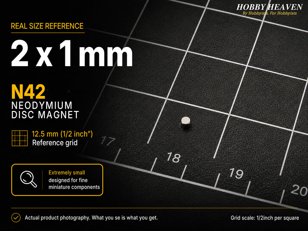 Single 2 x 1 mm N42 neodymium disc magnet shown at real size on a half-inch reference grid