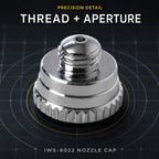 Iwata IWS-6022 nozzle cap viewed from above on cutting mat, showing the threaded stem and needle aperture at the tip