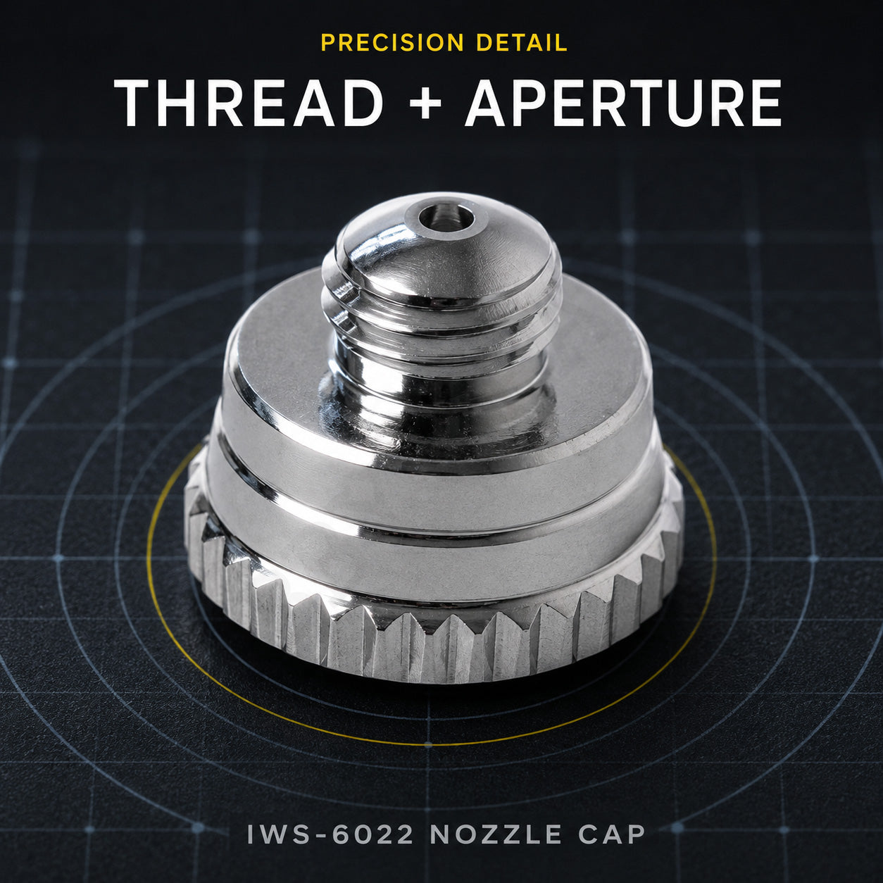 Iwata IWS-6022 nozzle cap viewed from above on cutting mat, showing the threaded stem and needle aperture at the tip