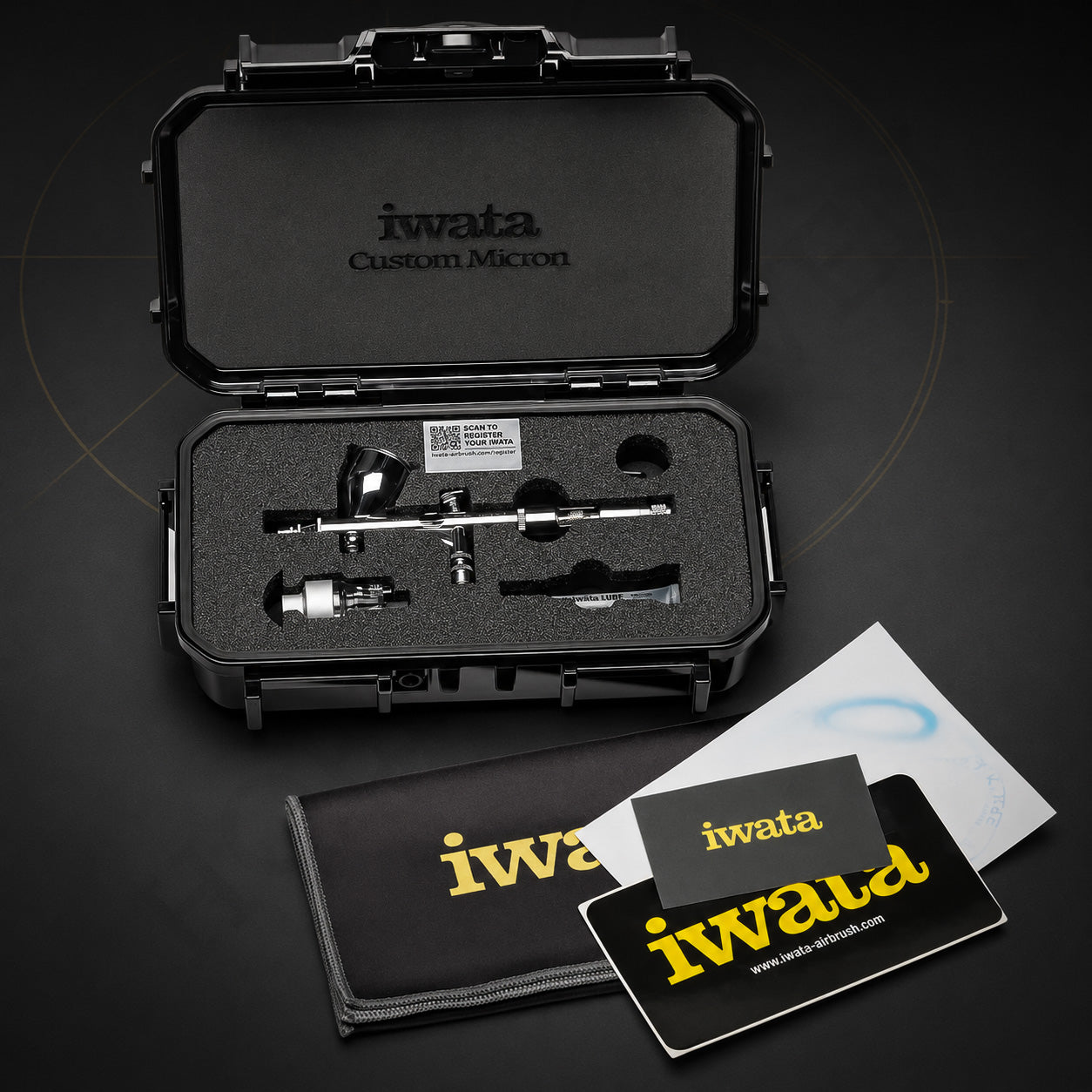 Custom Micron CM-C2 in its open hard case with the pistol-grip filter, a tube of Iwata Lube and a microfibre cloth