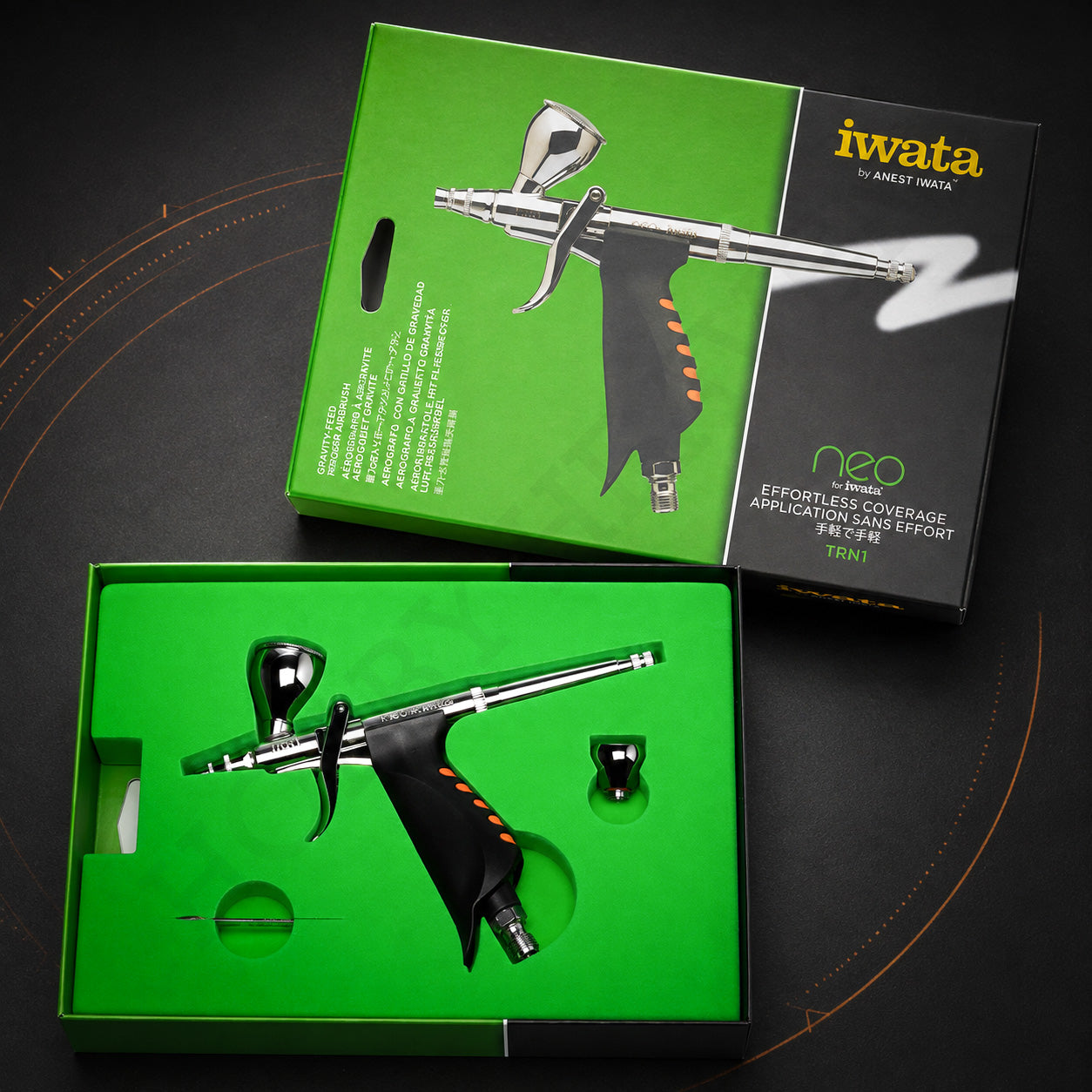 Neo for Iwata TRN1 in its open green box with the second, smaller fluid cup in its own recess