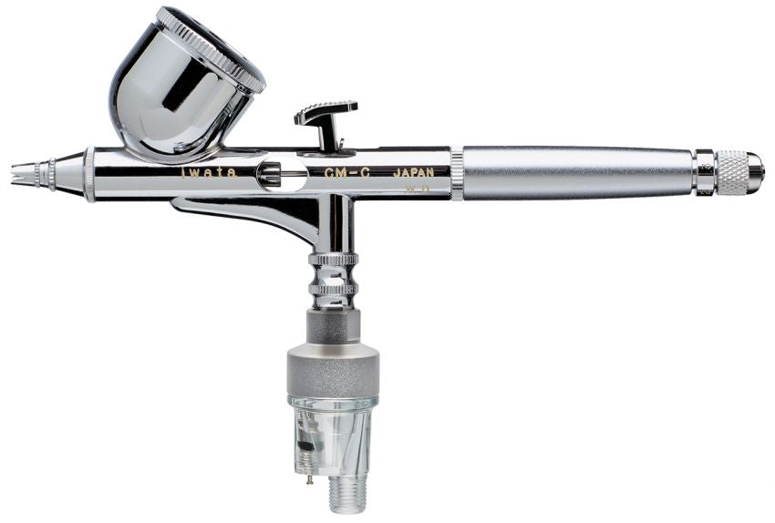 Iwata Custom Micron CM-C2 on white, side view with the pistol-grip moisture filter screwed to the air inlet