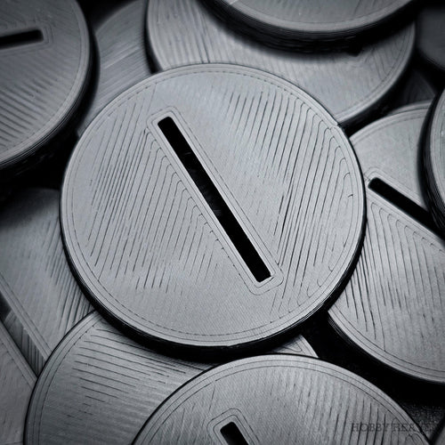Grey 3D-printed 40mm round slotted wargaming bases with a central slot for tab-mounted miniatures.