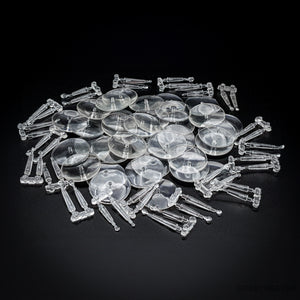 Piled clear acrylic flying bases, 32mm round, on a dark background